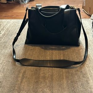 A New Day purse with carrying strap